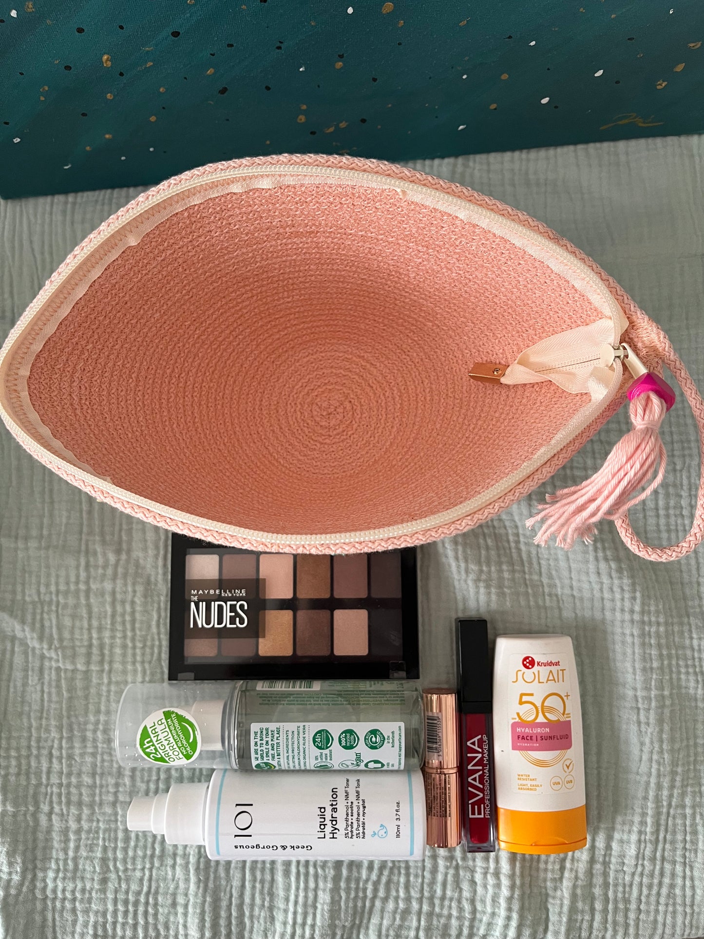 Soft pink zipper pouch designed for practical everyday organisation.
