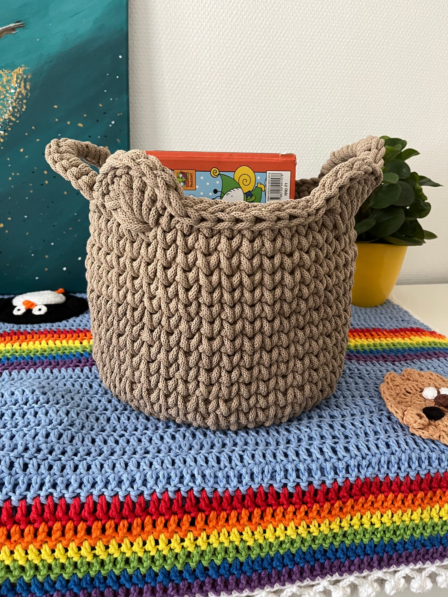 Handmade bear basket made from recycled cotton cord for toy storage in kids room.