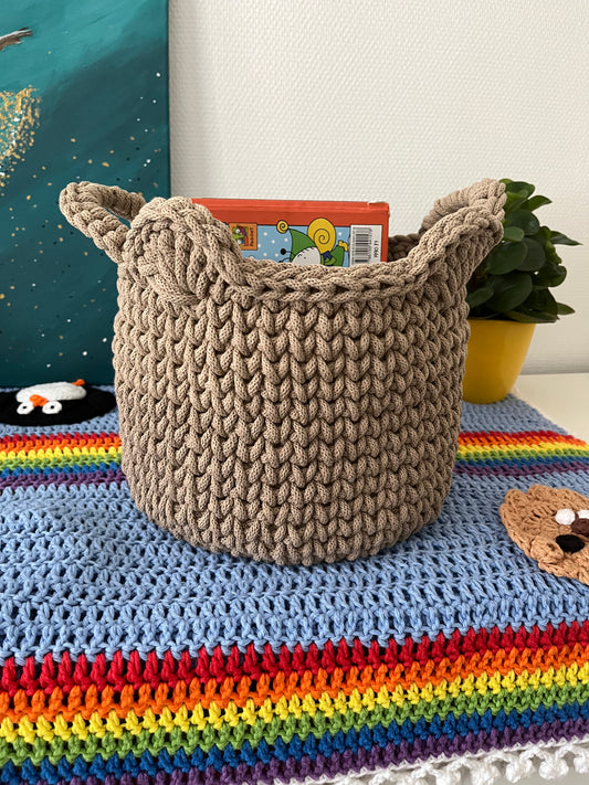Handmade bear basket made from recycled cotton cord for toy storage in kids room.