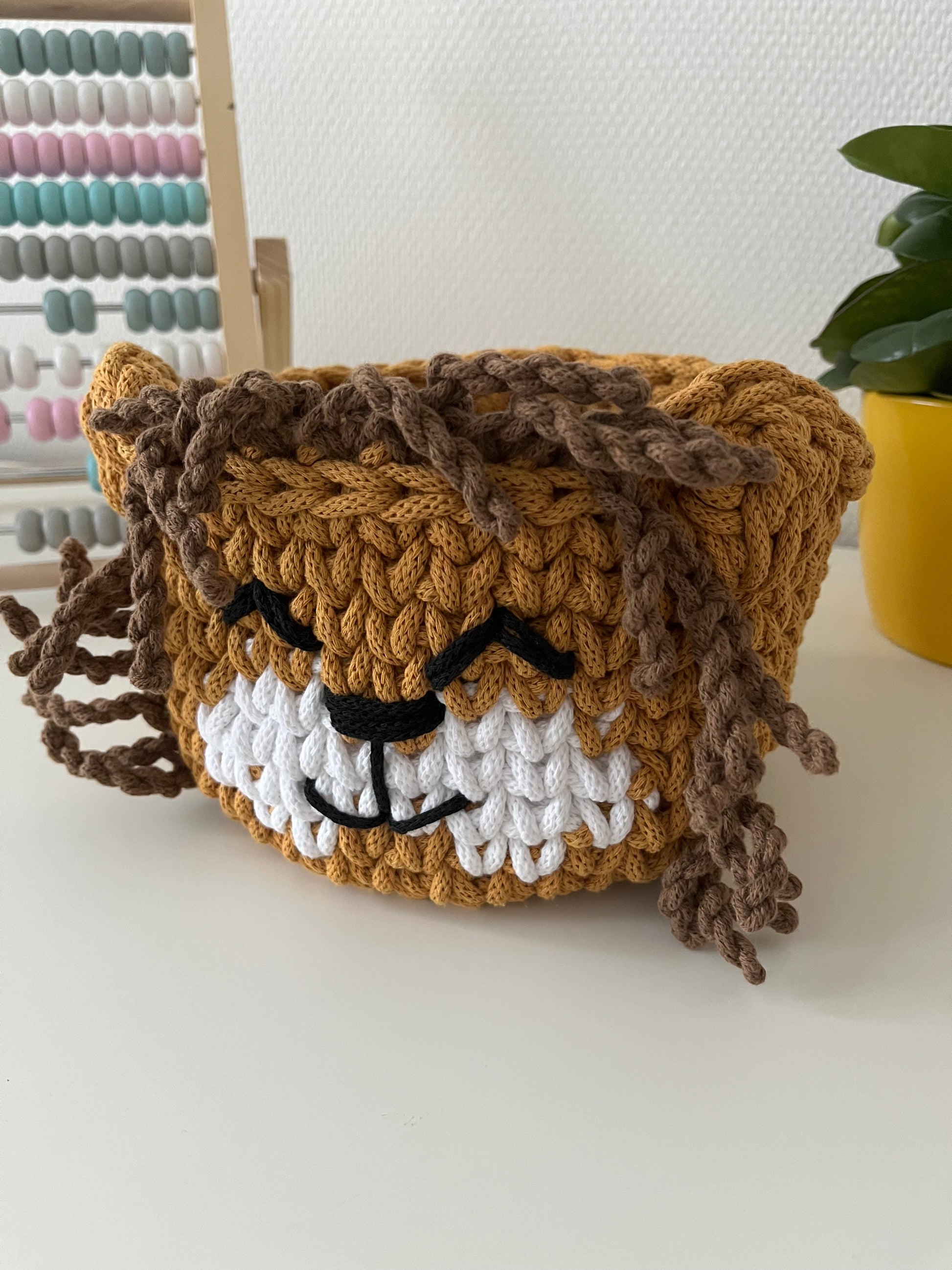 Handmade lion basket made from recycled cotton cord for toy storage in kids room