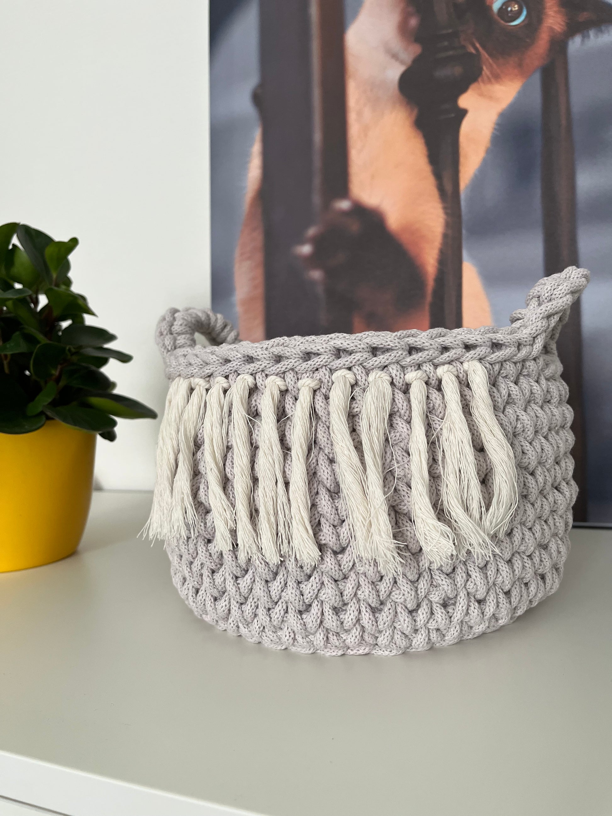Crochet storage basket for living room and bedroom use in neutral style.