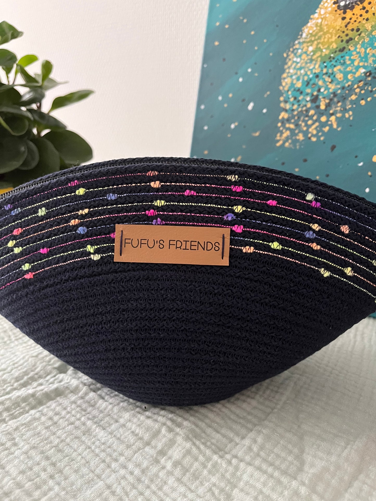 Boho-inspired cord pouch for storing makeup, toiletries, and small essentials.