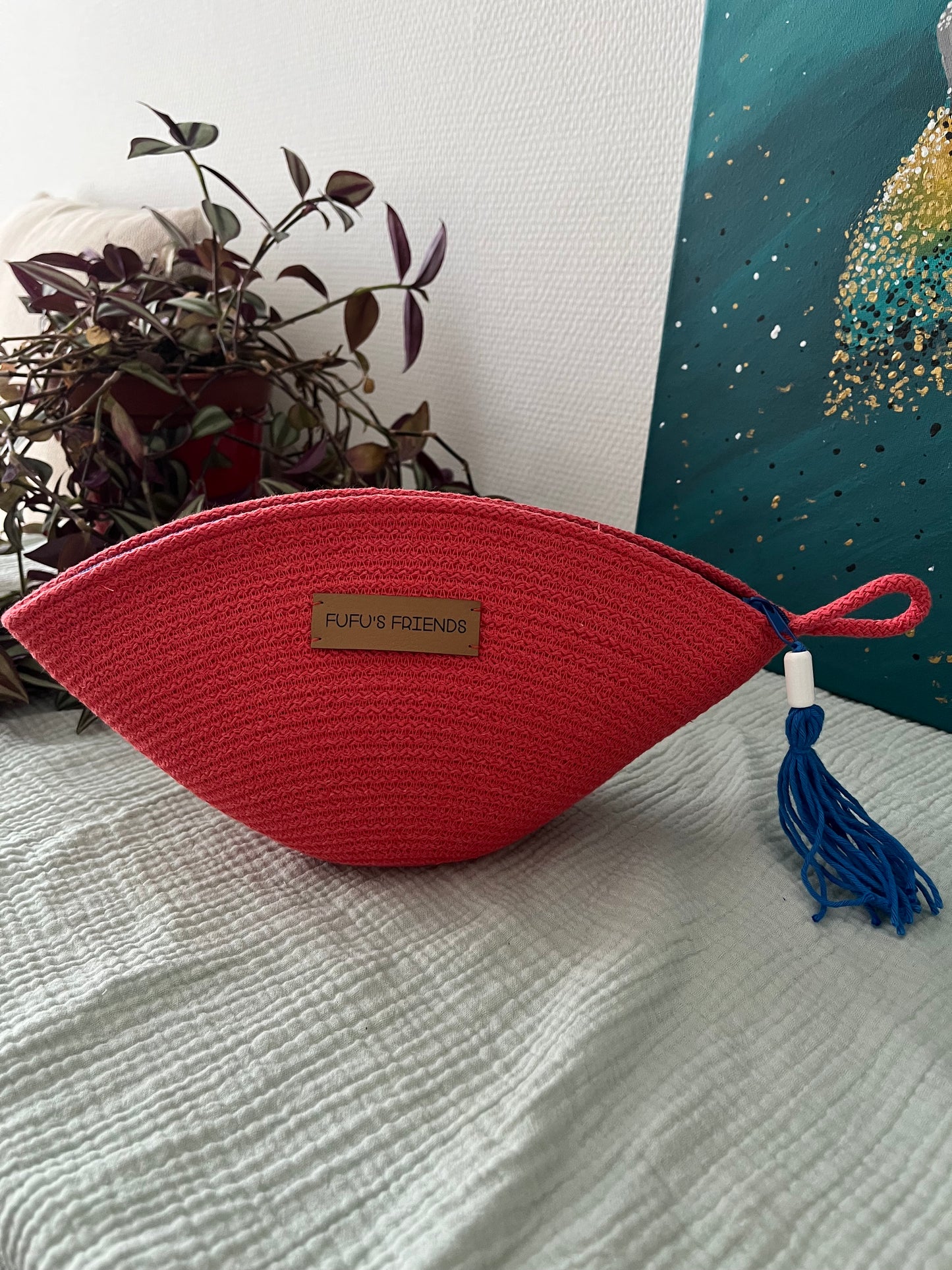 Makeup bag made from OEKO-TEX certified cord in coral.