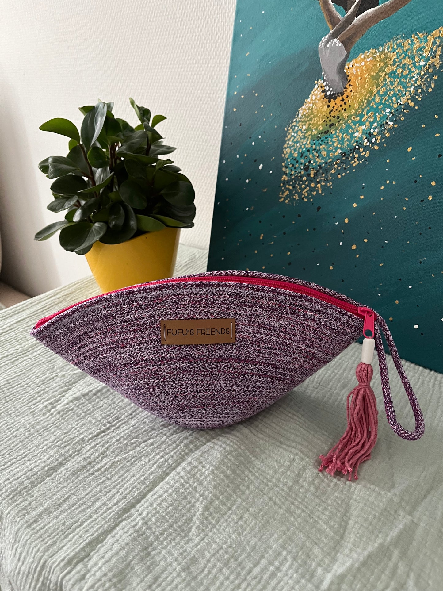 Boho-inspired zipper pouch for storing makeup, toiletries, and stationery.