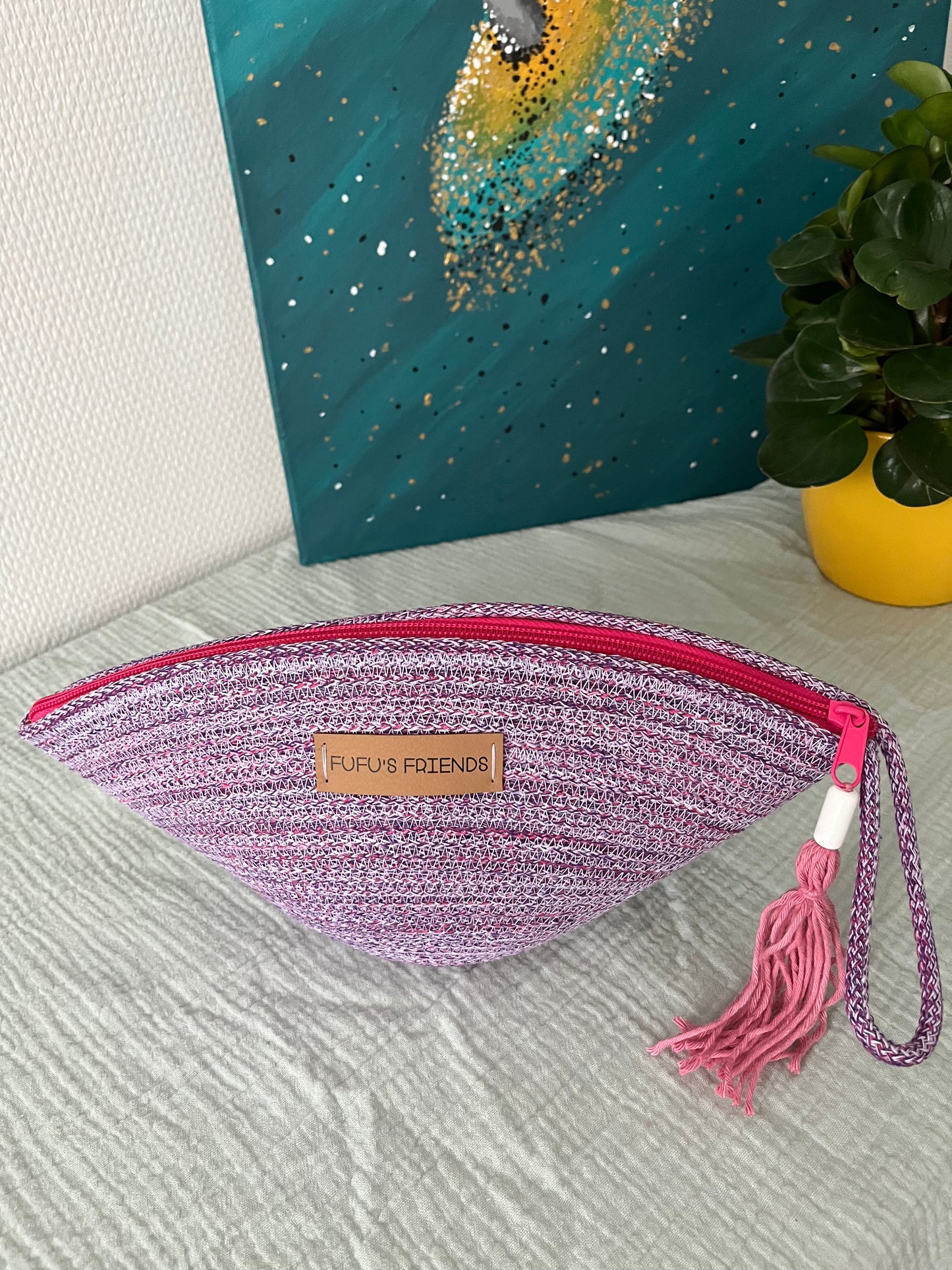 Festival cord pouch featuring lavender, fuchsia, and purple tones.