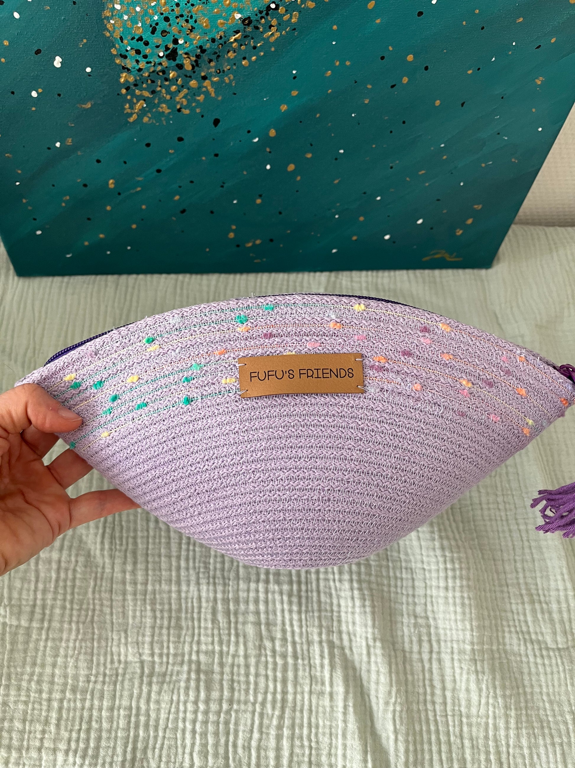 Handmade makeup bag made from OEKO-TEX certified cord in pastel lavender.