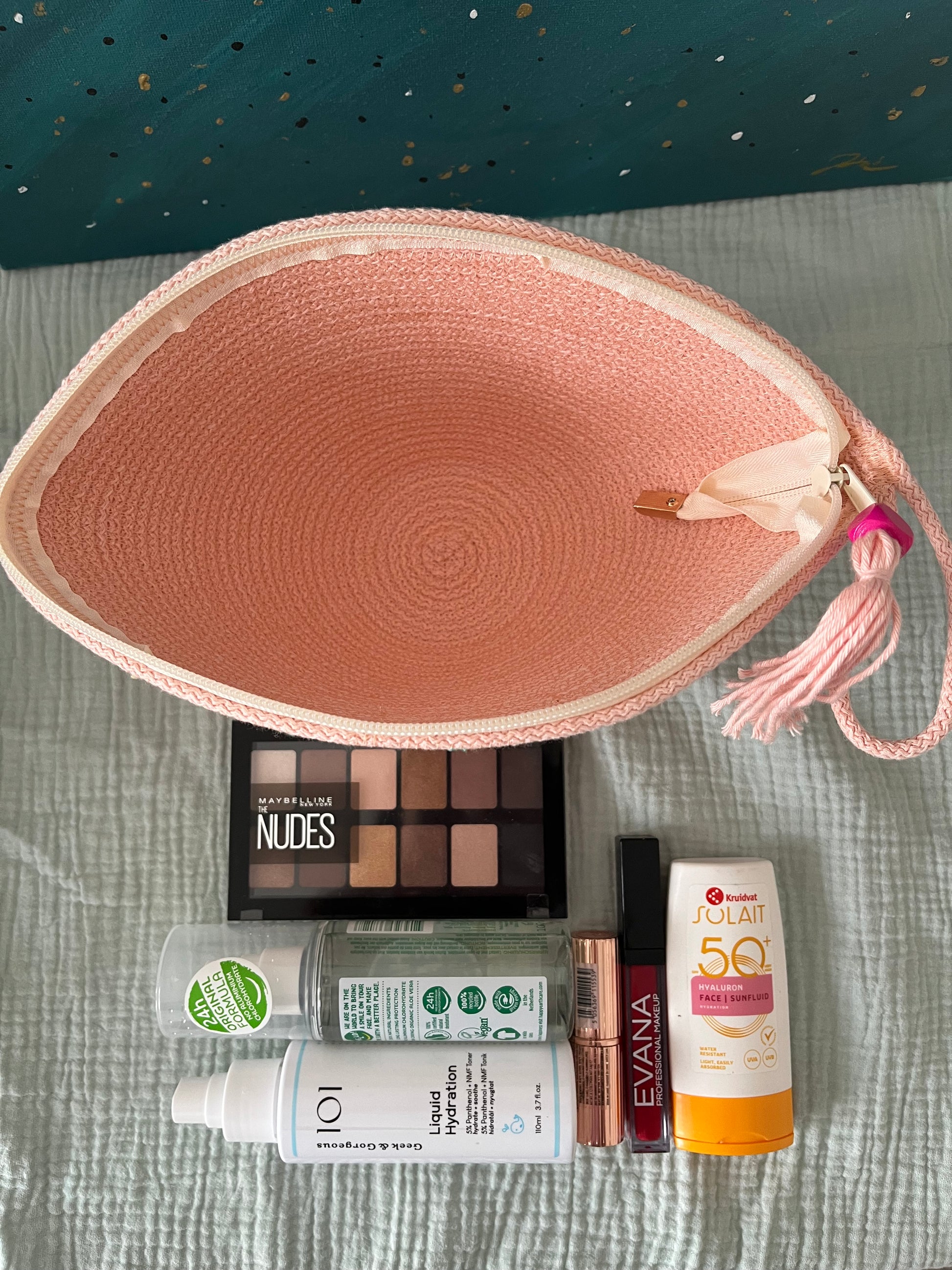 Soft pink zipper pouch designed for practical everyday organisation.
